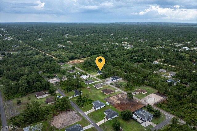 311 Long Ave S, Lehigh Acres, FL 33974 - view of property location featuring a heavily wooded area