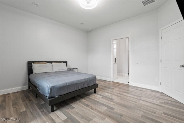 311 Long Ave S, Lehigh Acres, FL 33974 - bedroom featuring light wood-style floors and baseboards