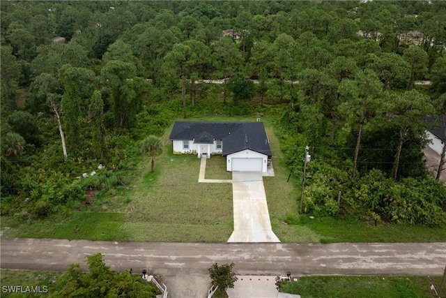 311 Long Ave S, Lehigh Acres, FL 33974 - aerial view of property and surrounding area with a heavily wooded area