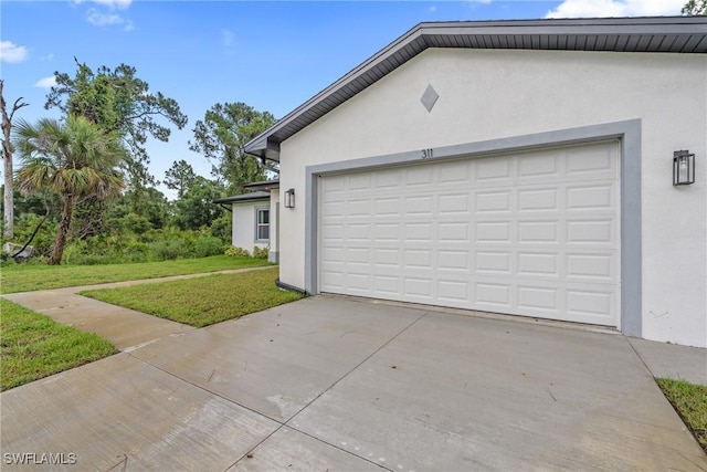 311 Long Ave S, Lehigh Acres, FL 33974 - garage with driveway