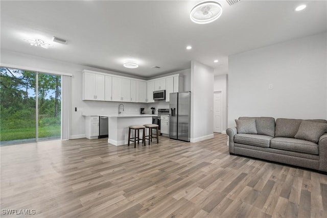 311 Long Ave S, Lehigh Acres, FL 33974 - living area with recessed lighting and light wood finished floors
