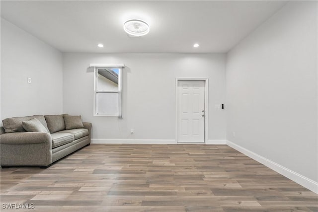 311 Long Ave S, Lehigh Acres, FL 33974 - living room featuring wood finished floors and recessed lighting