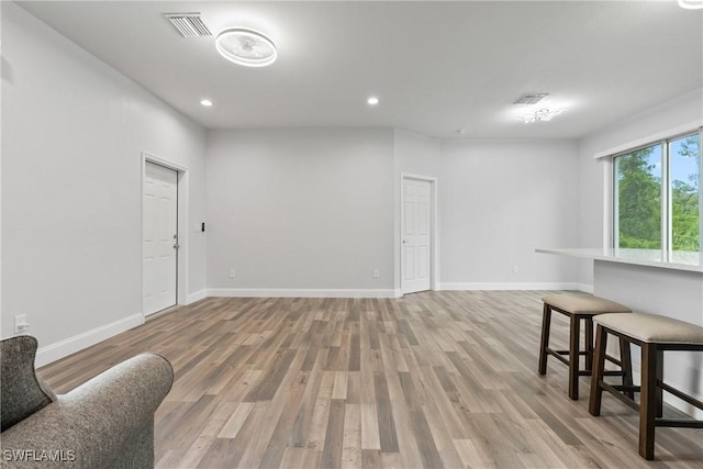 311 Long Ave S, Lehigh Acres, FL 33974 - living area featuring light wood-style floors and recessed lighting