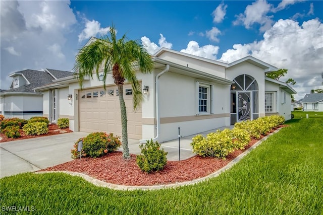 17791 Pineapple Palm Ct, North Fort Myers, FL 33917 - view of side of property with an attached garage, stucco siding, a lawn, and driveway