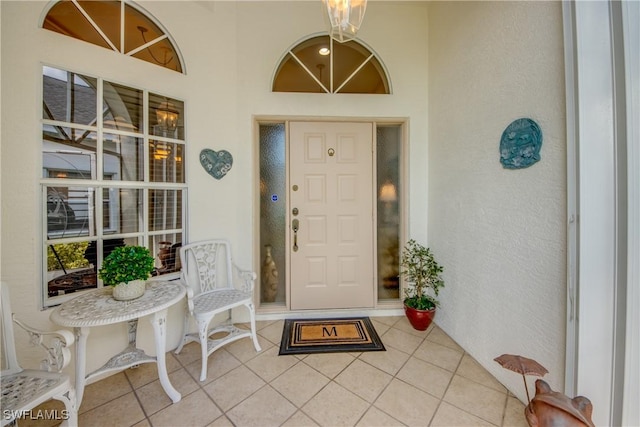 17791 Pineapple Palm Ct, North Fort Myers, FL 33917 - view of exterior entry with a porch and stucco siding