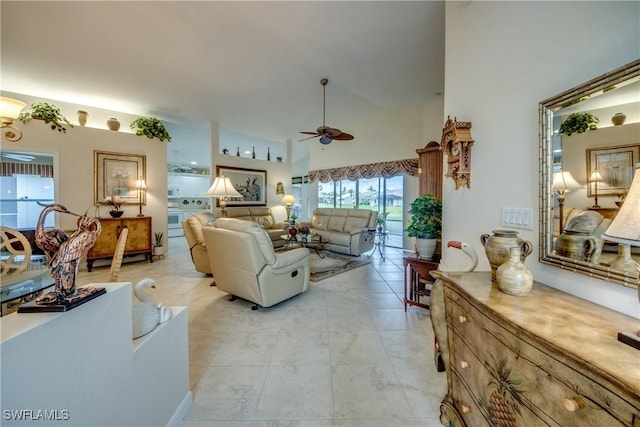17791 Pineapple Palm Ct, North Fort Myers, FL 33917 - living area with a ceiling fan, a towering ceiling, and light tile patterned floors