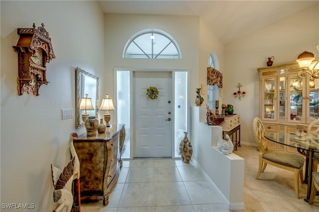17791 Pineapple Palm Ct, North Fort Myers, FL 33917 - foyer entrance featuring a towering ceiling and light tile patterned floors