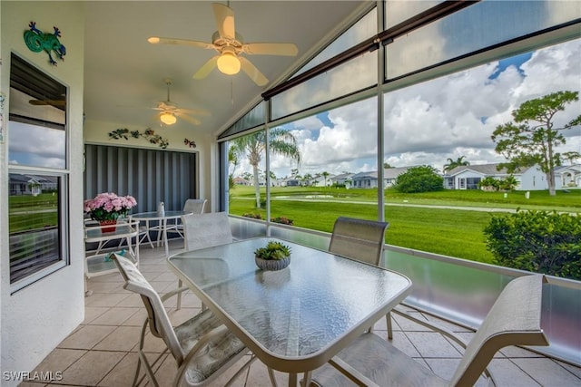 17791 Pineapple Palm Ct, North Fort Myers, FL 33917 - sunroom featuring outdoor dining area, lofted ceiling, ceiling fan, and a residential view
