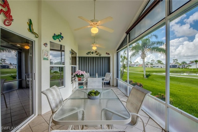 17791 Pineapple Palm Ct, North Fort Myers, FL 33917 - sunroom featuring a ceiling fan, lofted ceiling, outdoor dining area, and a water view