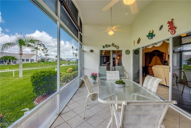 17791 Pineapple Palm Ct, North Fort Myers, FL 33917 - sunroom / solarium featuring ceiling fan, lofted ceiling, and outdoor dining area