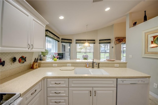 17791 Pineapple Palm Ct, North Fort Myers, FL 33917 - kitchen featuring white appliances, lofted ceiling, white cabinets, a peninsula, and hanging light fixtures