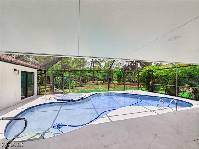 490 25th St SW, Naples, FL 34117 - view of pool with glass enclosure, a patio area, and a pool with connected hot tub
