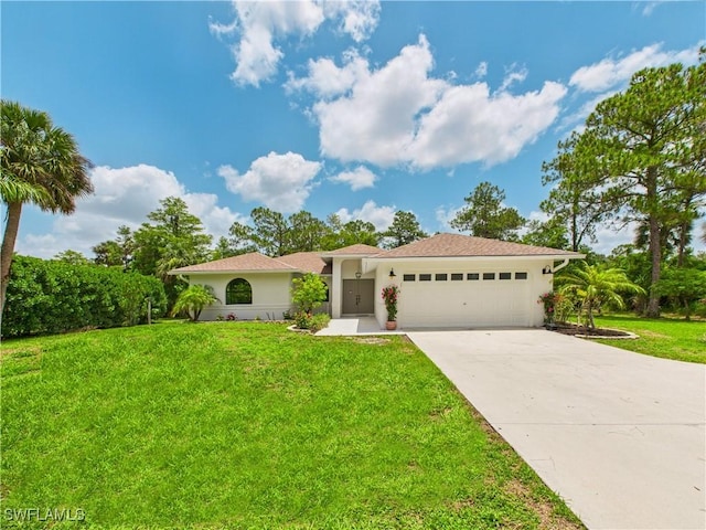 490 25th St SW, Naples, FL 34117 - view of front of home with an attached garage, concrete driveway, a front yard, and stucco siding