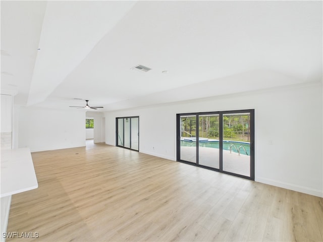 490 25th St SW, Naples, FL 34117 - spare room with light wood-type flooring and a ceiling fan