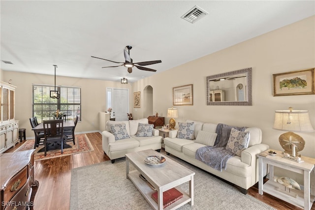 12905 Pastures Way, Fort Myers, FL 33913 - living room with wood finished floors, arched walkways, and ceiling fan