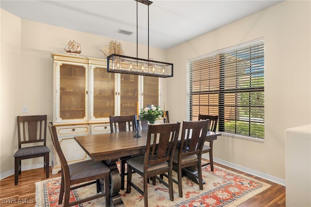12905 Pastures Way, Fort Myers, FL 33913 - dining room featuring wood finished floors and a chandelier