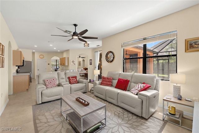 12905 Pastures Way, Fort Myers, FL 33913 - living room with healthy amount of natural light, ceiling fan, arched walkways, light tile patterned flooring, and recessed lighting