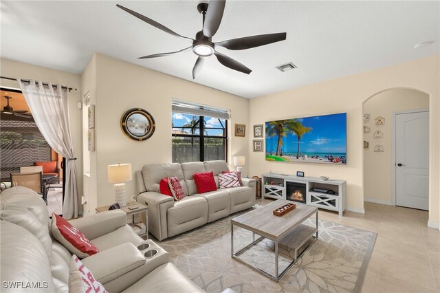12905 Pastures Way, Fort Myers, FL 33913 - living area featuring ceiling fan, arched walkways, and light tile patterned flooring