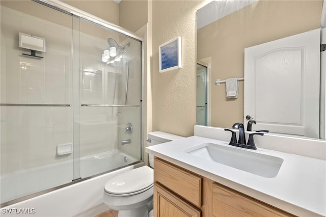 12905 Pastures Way, Fort Myers, FL 33913 - bathroom with a textured wall, vanity, and enclosed tub / shower combo