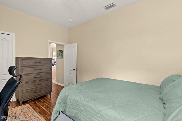 12905 Pastures Way, Fort Myers, FL 33913 - bedroom featuring dark wood-style flooring