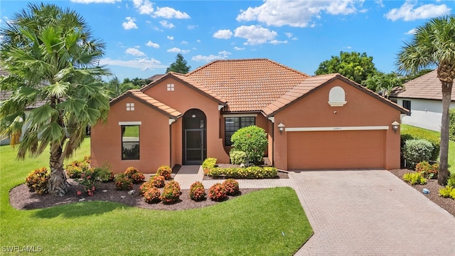 12905 Pastures Way, Fort Myers, FL 33913 - view of front of house with an attached garage, stucco siding, a front lawn, decorative driveway, and a tiled roof