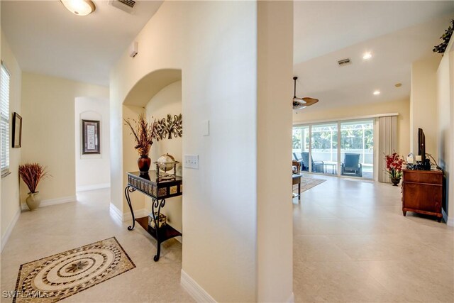 2102 SW 47th St, Cape Coral, FL 33914 - hall featuring arched walkways, tile patterned flooring, and recessed lighting