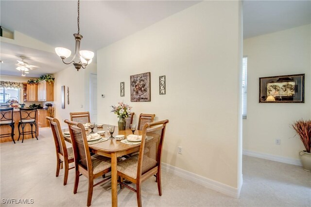 2102 SW 47th St, Cape Coral, FL 33914 - dining area with ceiling fan and a chandelier