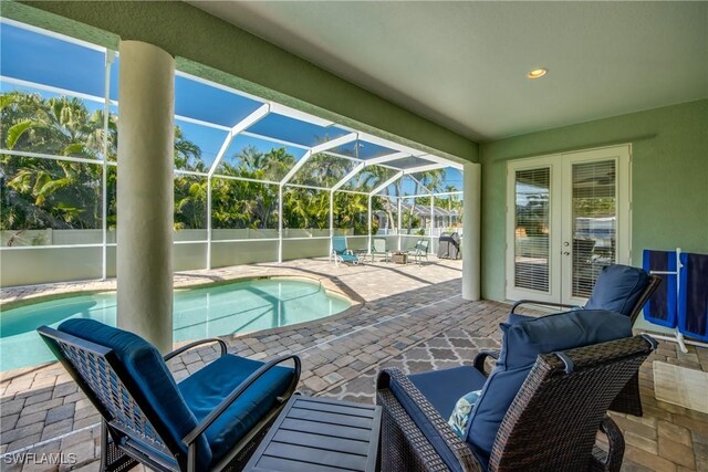 2102 SW 47th St, Cape Coral, FL 33914 - view of pool with a patio area, glass enclosure, and french doors