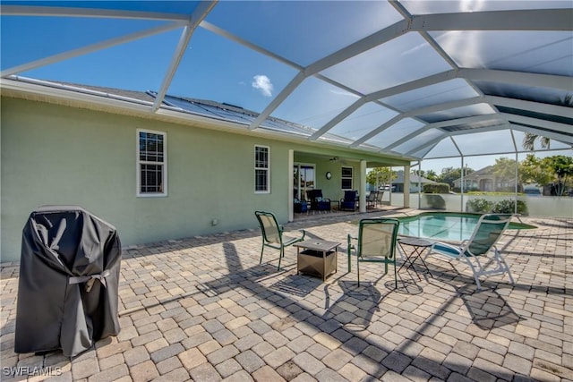 2102 SW 47th St, Cape Coral, FL 33914 - view of patio with a ceiling fan, a grill, an outdoor pool, and a lanai