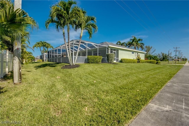 2102 SW 47th St, Cape Coral, FL 33914 - view of grassy yard featuring glass enclosure