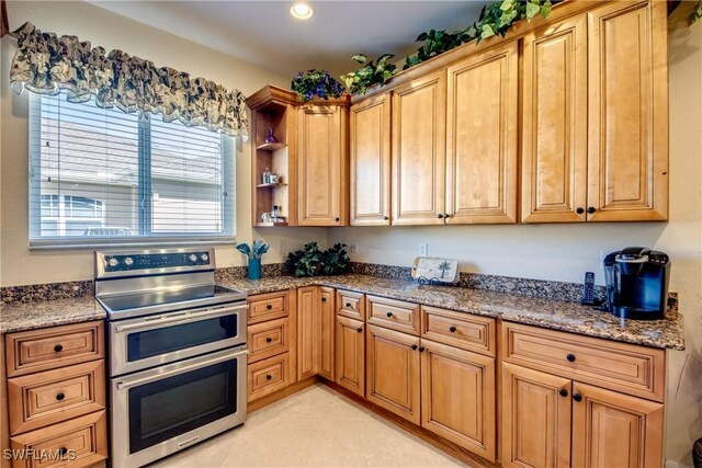 2102 SW 47th St, Cape Coral, FL 33914 - kitchen with range with two ovens, stone counters, open shelves, and recessed lighting