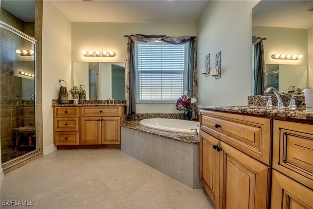 2102 SW 47th St, Cape Coral, FL 33914 - full bath with a stall shower, a garden tub, and two vanities