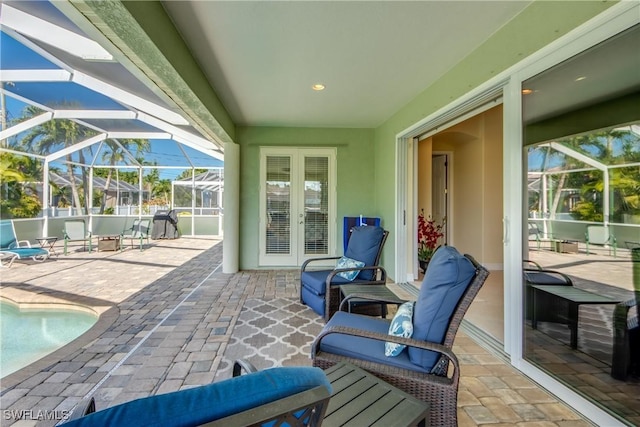 2102 SW 47th St, Cape Coral, FL 33914 - view of patio / terrace with french doors, an outdoor pool, and a lanai
