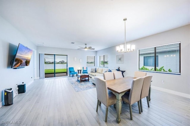 4955 Brigata Way, Ave Maria, FL 34142 - dining room featuring light wood finished floors, a chandelier, and ceiling fan