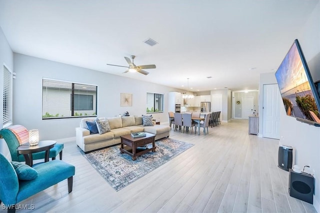 4955 Brigata Way, Ave Maria, FL 34142 - living room with light wood-style flooring and ceiling fan