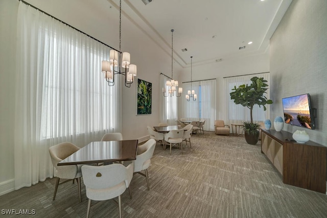4955 Brigata Way, Ave Maria, FL 34142 - carpeted dining room with a chandelier, healthy amount of natural light, and a towering ceiling