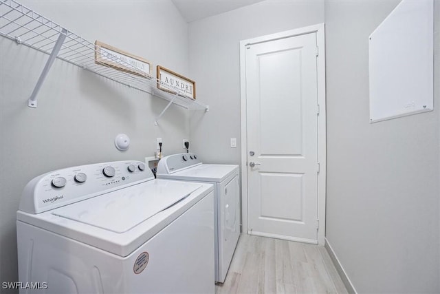 4955 Brigata Way, Ave Maria, FL 34142 - washroom featuring washer and dryer and light wood-style flooring