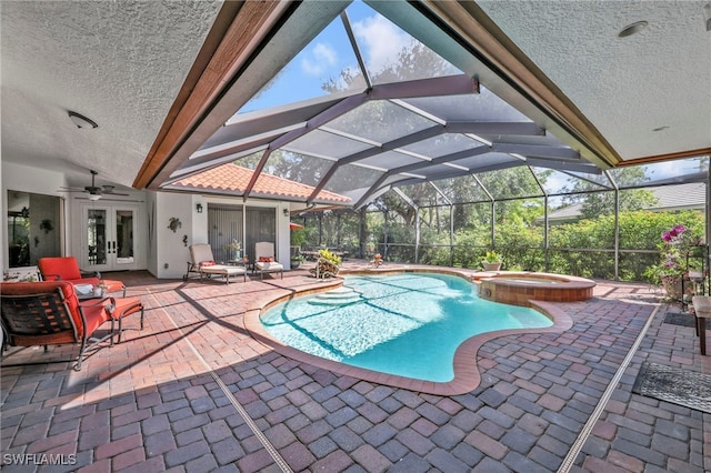 4000 Stonesthrow Ct, Naples, FL 34109 - view of pool featuring french doors, a patio area, a pool with connected hot tub, and glass enclosure