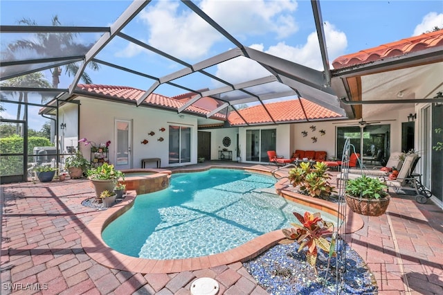 4000 Stonesthrow Ct, Naples, FL 34109 - view of pool with a pool with connected hot tub, a patio area, and a lanai