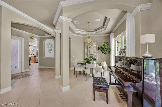 4000 Stonesthrow Ct, Naples, FL 34109 - interior space featuring arched walkways, a chandelier, decorative columns, light tile patterned floors, and ornamental molding