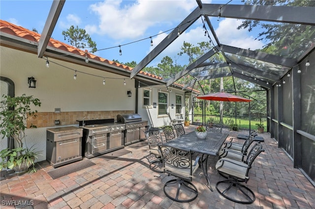 4000 Stonesthrow Ct, Naples, FL 34109 - view of patio / terrace with area for grilling, a lanai, and outdoor dining area