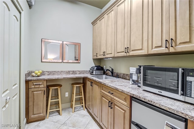 4000 Stonesthrow Ct, Naples, FL 34109 - laundry room featuring a sink and light tile patterned floors