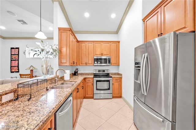 4000 Stonesthrow Ct, Naples, FL 34109 - kitchen featuring appliances with stainless steel finishes, ornamental molding, light stone counters, light tile patterned flooring, and hanging light fixtures