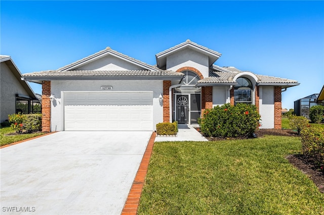 12730 Kelly Palm Dr, Fort Myers, FL 33908 - view of front facade with an attached garage, a front yard, driveway, brick siding, and stucco siding