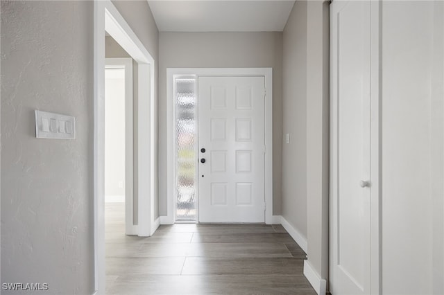 12730 Kelly Palm Dr, Fort Myers, FL 33908 - foyer entrance featuring baseboards and wood finished floors