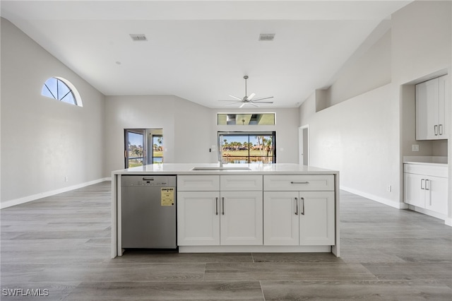 12730 Kelly Palm Dr, Fort Myers, FL 33908 - kitchen featuring stainless steel dishwasher, lofted ceiling, a ceiling fan, white cabinetry, and healthy amount of natural light
