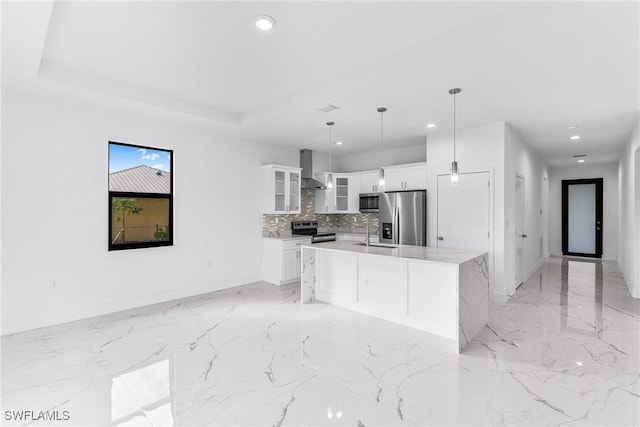 7029 Palpano Cir, Labelle, FL 33935 - kitchen with stainless steel appliances, recessed lighting, wall chimney exhaust hood, white cabinets, and glass insert cabinets