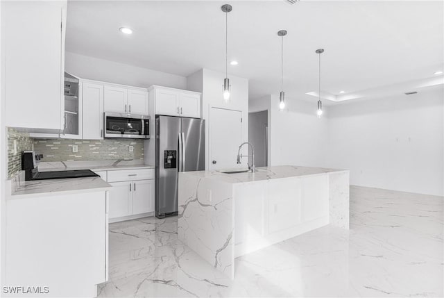 7029 Palpano Cir, Labelle, FL 33935 - kitchen featuring stainless steel appliances, recessed lighting, white cabinetry, tasteful backsplash, and hanging light fixtures