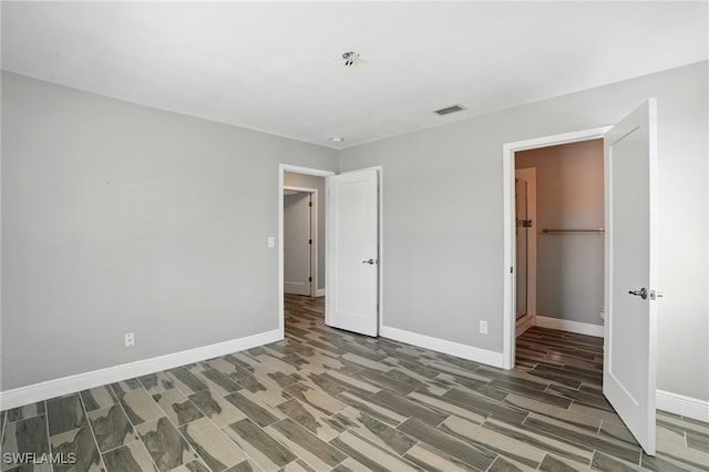 5557 Estero Blvd, Fort Myers Beach, FL 33931 - unfurnished bedroom with baseboards and wood finished floors