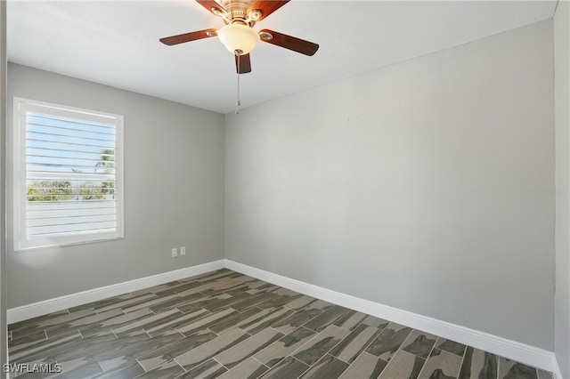 5557 Estero Blvd, Fort Myers Beach, FL 33931 - spare room with a ceiling fan and wood finished floors
